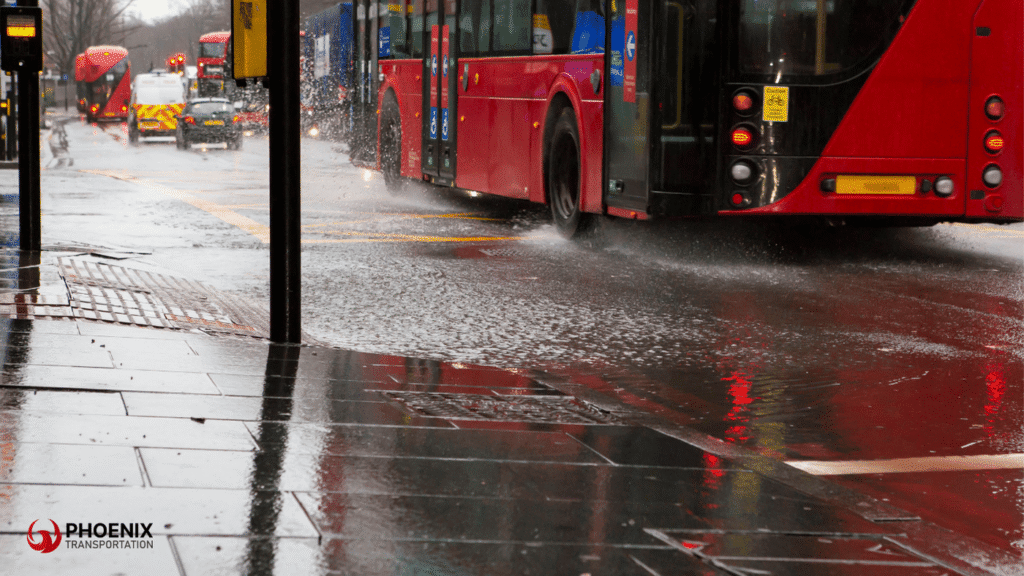 Buses and Cars in the street while raining