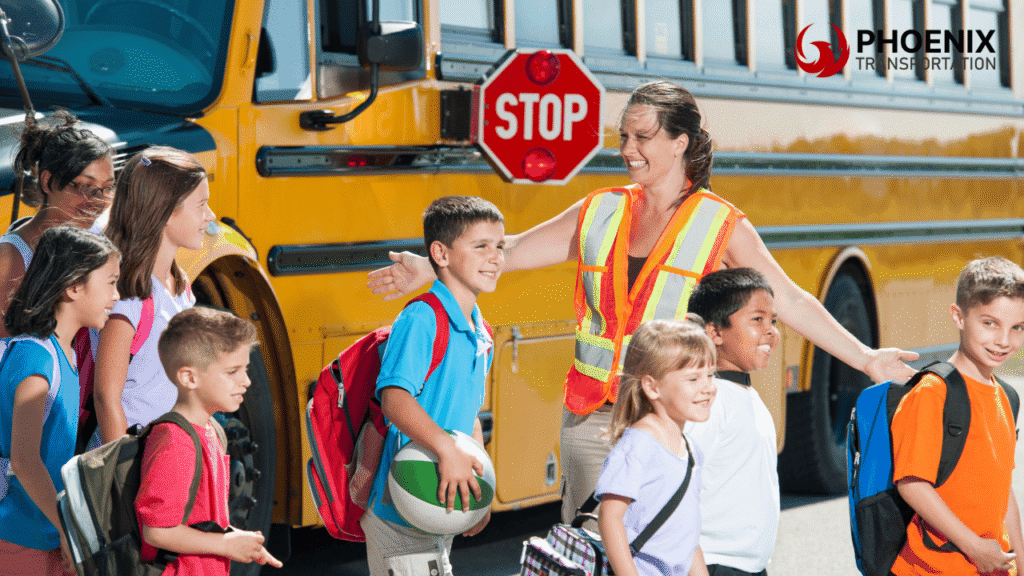 Students Lining Up with Teacher Instructing Yellow Bus in the Background