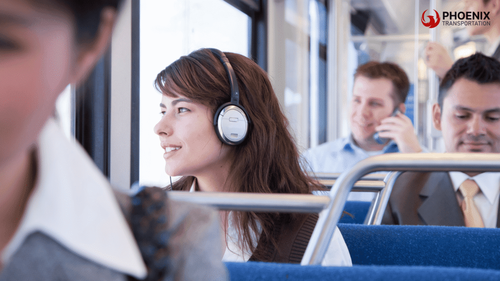 Woman smiling on a bus while planning her commute with the Oakland bus schedule